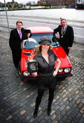 1978-2008 Celebrating thirty years of the Semperit Irish Car of the Year: Paddy Murphy, Semperit Ireland, and Tony Toner, chairman of the Irish Motoring Writers Association, with model Jenny Lee Masterson in 1978-garb at the announcement of the list of runners for the 2009 awards. Also in the picture is a Mk I VW Golf, the car that won the inaugural Irish Car of the Year award in 1978.