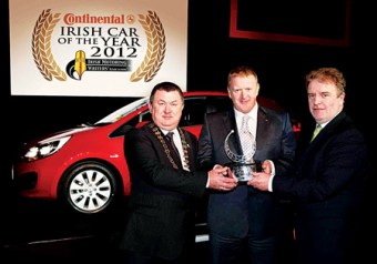 Pictured are Gerry Murphy, chairman of the IMWA; James Brooks, managing director, KIA Ireland; and Paddy Murphy, general manager of Continental Tyres.