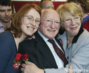 Alice Mary Higgins with her parents Michael D and Sabina.