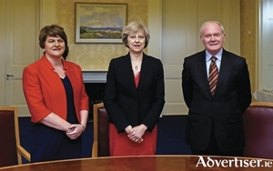 NI First Minister Arlene Foster, British PM Theresa May, and NI Deputy First Minister Martin McGuinness at Stormont on Monday.