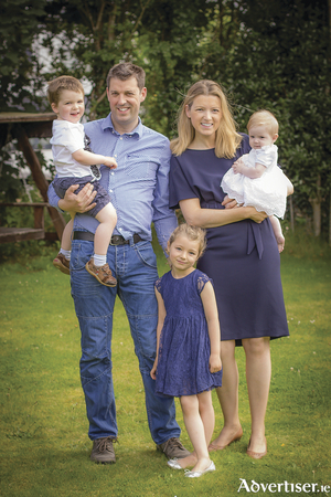 John Walsh, pictured with his wife Edel and three daughters.