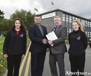 Pictured after the signing are L to R: Brian Melia, Principal of GCC (left) and Dr Fergal Barry, President of GMIT, with fifth year GCC students Wiktoria Gorczyca (left), Headford Road, and Alanna O&rsquo;Reilly, Ballybane. [Photo by Joe Travers.