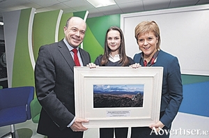 Denis Naughten, Minister for Communications, Climate Action and Environment and First Minister of Scotland, Nicola Sturgeon presenting the SSE and Coillte Winter Wildlife and Habitats photographic competition winner to Grace Hooper, (age 13) St Pauls Secondary School, Oughterard, Co Galway with her photo titled &lsquo;Snow capped mountains&rsquo; Roscahill, Co Galway. Picture Conor McCabe Photography.