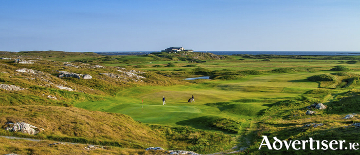 Golfers enjoying Connemara Golf Links, in Co Galway. Photo taken from connemaragolflinks.com