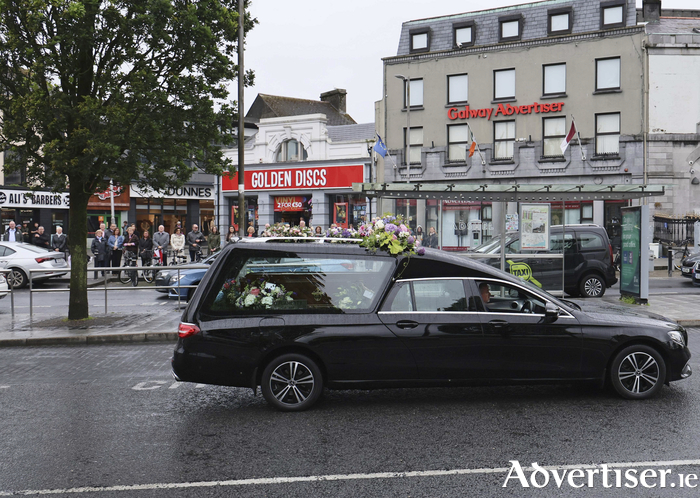 The funeral cortege of the late Ronnie O’Gorman stops outside the Galway Advertiser newspaper office at Eyre Square on Tuesday. Photo: Mike Shaughnessy.