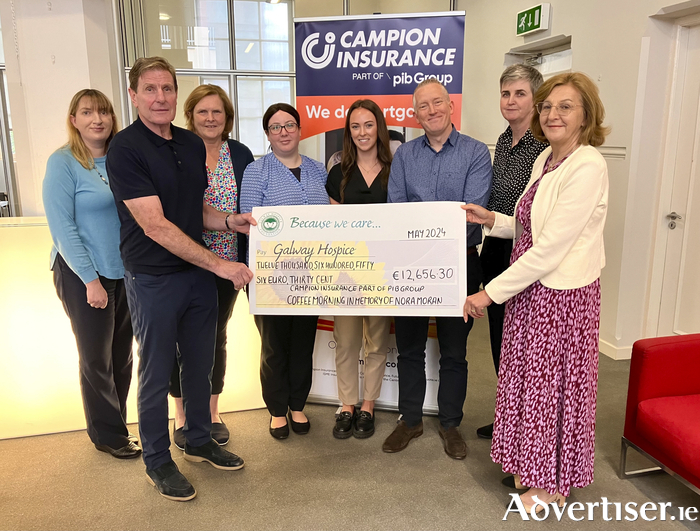 Campion Insurance presenting the proceeds of their Coffee Mornings in memory of Nora Moran to Galway Hospice. Pictured are Maureen Donnellan, Michael McLaughlin, Norma Campbell, Lyndsay Walshe, Jade Sweeney, Matthew Head, Anne-Marie Byrne, Campion Insurance, and Mary Nash, Galway Hospice CEO.