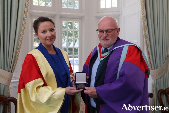 Professor Anna Odrowaz-Coates, Chairholder of the UNESCO Janusz Korczak Chair and Vice-rector at the Maria Grzegorzewska University, presents the Medal of the Maria Grzegorzewska University in Warsaw to University of Galway’s Professor Pat Dolan for his life-long work and achievements in the field of children’s rights.