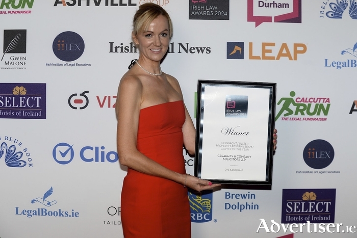 Sinéad Geraghty of Geraghty & Co Solicitors LLP with the company's award for Connacht/Ulster Property Law Firm of the Year.
