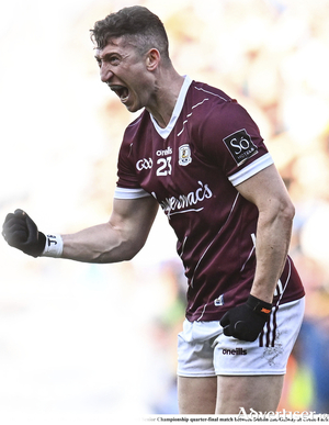 Johnny Heaney of Galway 
celebrates kicking a point during the GAA Football All-Ireland Senior Championship quarter-final match between Dublin and Galway.