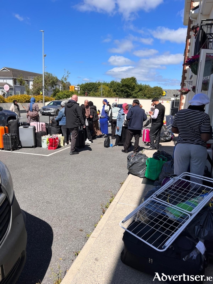 The evicted women with their belongings in Doughiska on Wednesday morning