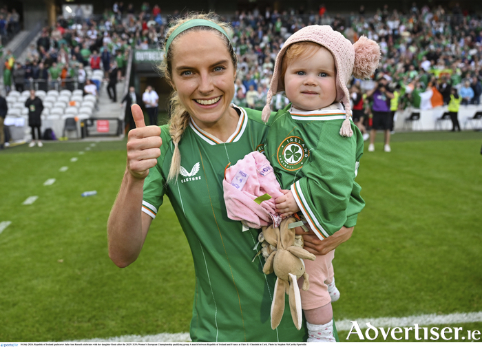 Republic of Ireland goalscorer Julie-Ann Russell celebrates with her daughter Rosie after the Women's European Championship qualifying match against France at Páirc Uí Chaoimh in Cork. 