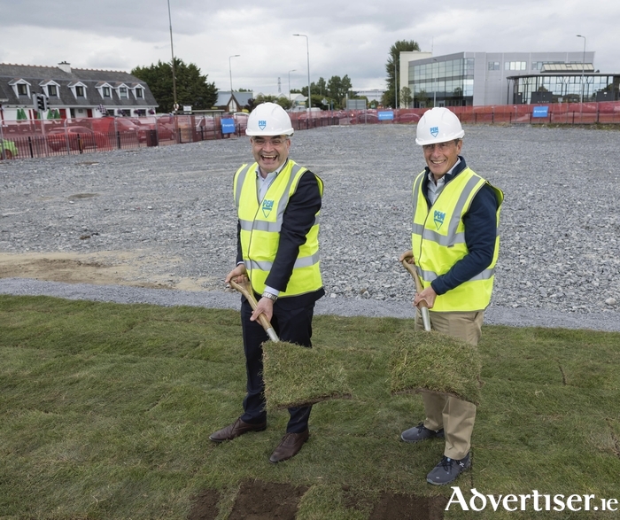 Minister of State Dara Calleary TD turning the sod in Mervue with Eric Ruttenberg of Penn Engineering and Tinicum Capital Partners, New York. 
Photo: Hugh Sweeney