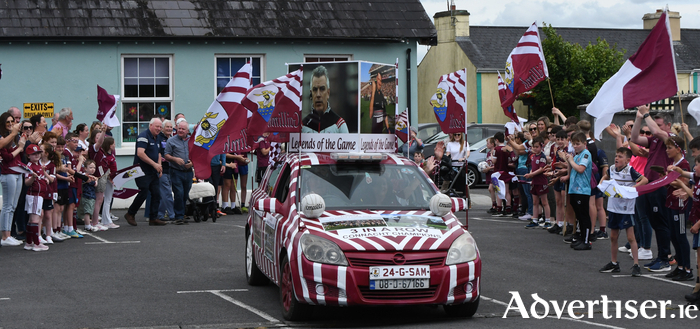 Motoring for Maroon - Philip Coleman, Ballygar getting his Galway-bedecked car ready for Sunday's Final. The scene pictured here will feature in Saturday's Up for the Match :Pic Peter Daly
