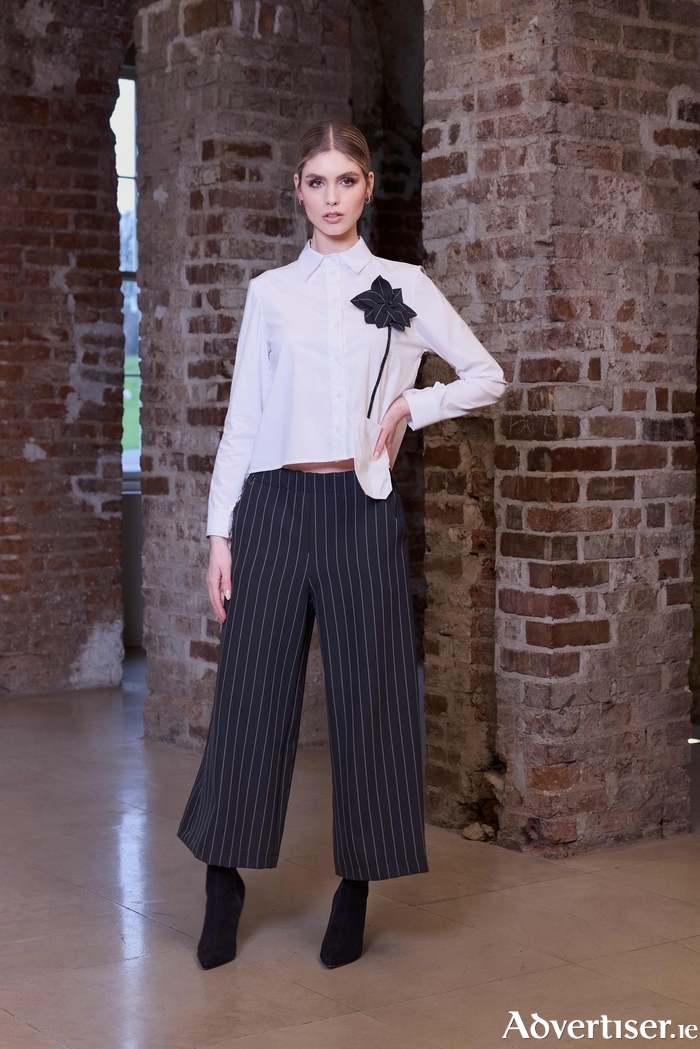 Kate Cooper shirt with flower trim (€109) and pinstriped wide-legged trousers (€126).