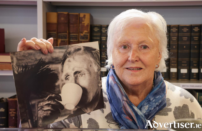 Dr Mary Warde Moriarty with a photo of her father Edward Warde. Photo: Aengus McMahon