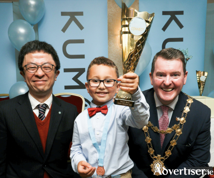 Kumon Connect Junior Champion, Daniel Samy with Mayor of Galway Cllr Peter Keane and Mr Seike, deputy general manager of Kumon Europe and Japan at the presentation of awards to Kumon Students, in the Menlo Park Hotel on Sunday.  Photo: Mike Shaughnessy. 
