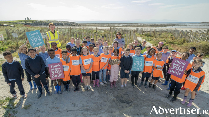 Third class pupils and teachers of Claddagh NS pictured after they took part in the Big Beach Clean at Grattan Beach last Friday morning, with Uisce Éireann's Mark Higgins.  Picture credits: Patrick Cross (Clean Coasts)
