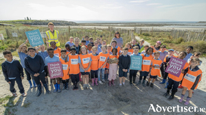 Third class pupils and teachers of Claddagh NS pictured after they took part in the Big Beach Clean at Grattan Beach last Friday morning, with Uisce &Eacute;ireann&#039;s Mark Higgins.  Picture credits: Patrick Cross (Clean Coasts)
