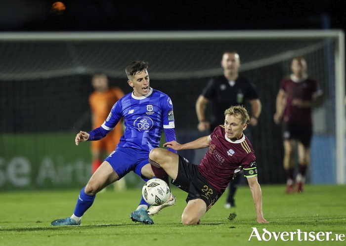 Dean McMenamy of Waterford is tackled by Conor McCormack of Galway United during Friday's match.