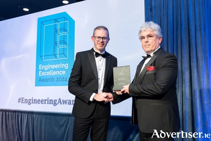 Senior Engineer Colm Ó Ríordáin collecting the Civil Engineering Project of the Year award at the Engineering Excellence Awards.