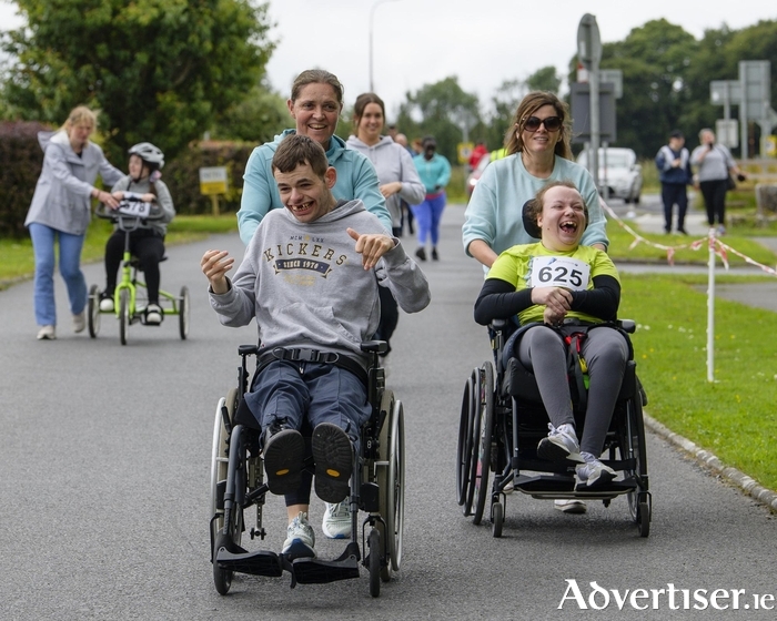 Bernie Fleming and Irene Lynch with service users Liam Leonard and Chelsey Walsh.