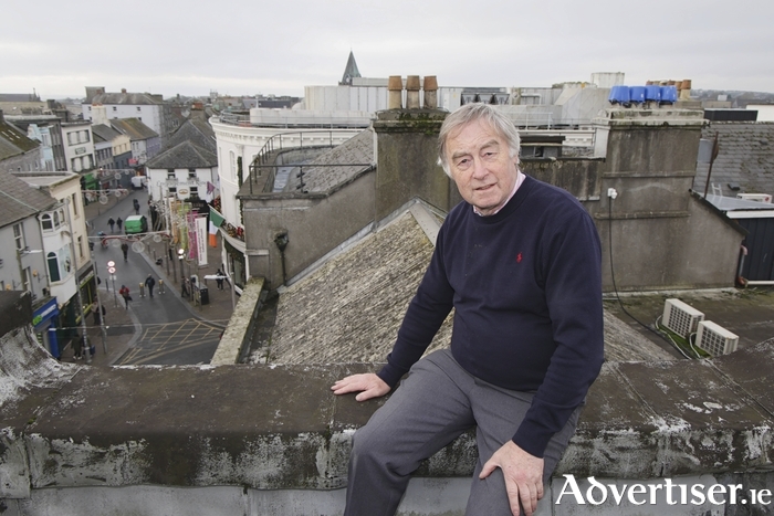 Transport campaigner Brendan Holland looks out at a city ripe for light rail from the roof of Hollands Newsagents on Williamsgate Street (Photo: Mike Shaughnessy)