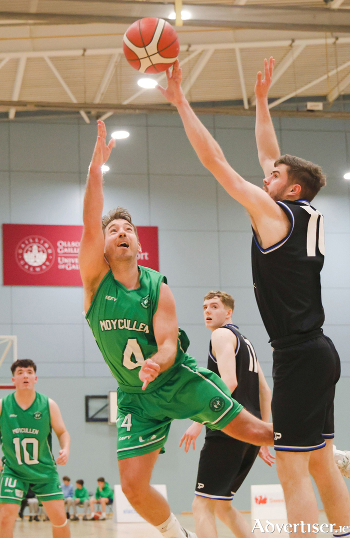 Maigh Cuilinn’s Dylan Cunningham is blocked by Mather Private Malahide’s Oisin Rice in action from the Basketball Ireland Men’s Division 1 game at University of Galway Kingfisher on Saturday night. It was heartbreak for Moycullen as the game ended 71 -76 in overtime. 