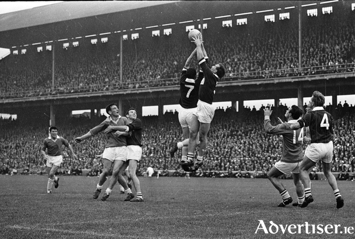 Noel Tierney (right) and Martin Newell of Galway, in action during the All-Ireland Senior Football Final, Galway v Meath. on 25 September 1966. Picture: Connolly Collection / SPORTSFILE.