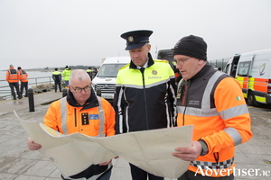 L to R: Brendan Qualter, Civil Defence,&nbsp;Garda Superintendent Paulie O&#039;Shea, and Coast Guard Sector Manager Sean Conroy, co-ordinate the search for a missing swimmer at Silverstrand on Wednesday.&nbsp; (Photo: Mike Shaughnessy)&nbsp;