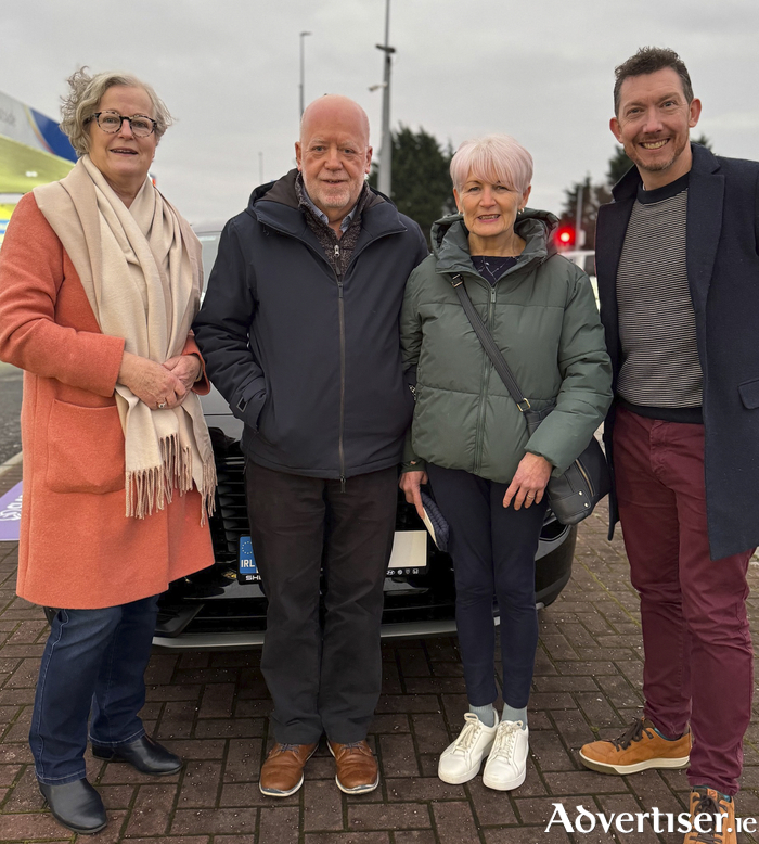 L-R Joan Raleigh (Director at Claddagh Credit Union)  Robert Gurry and Partner (winner of car) and Ronan Lardner (car draw host).